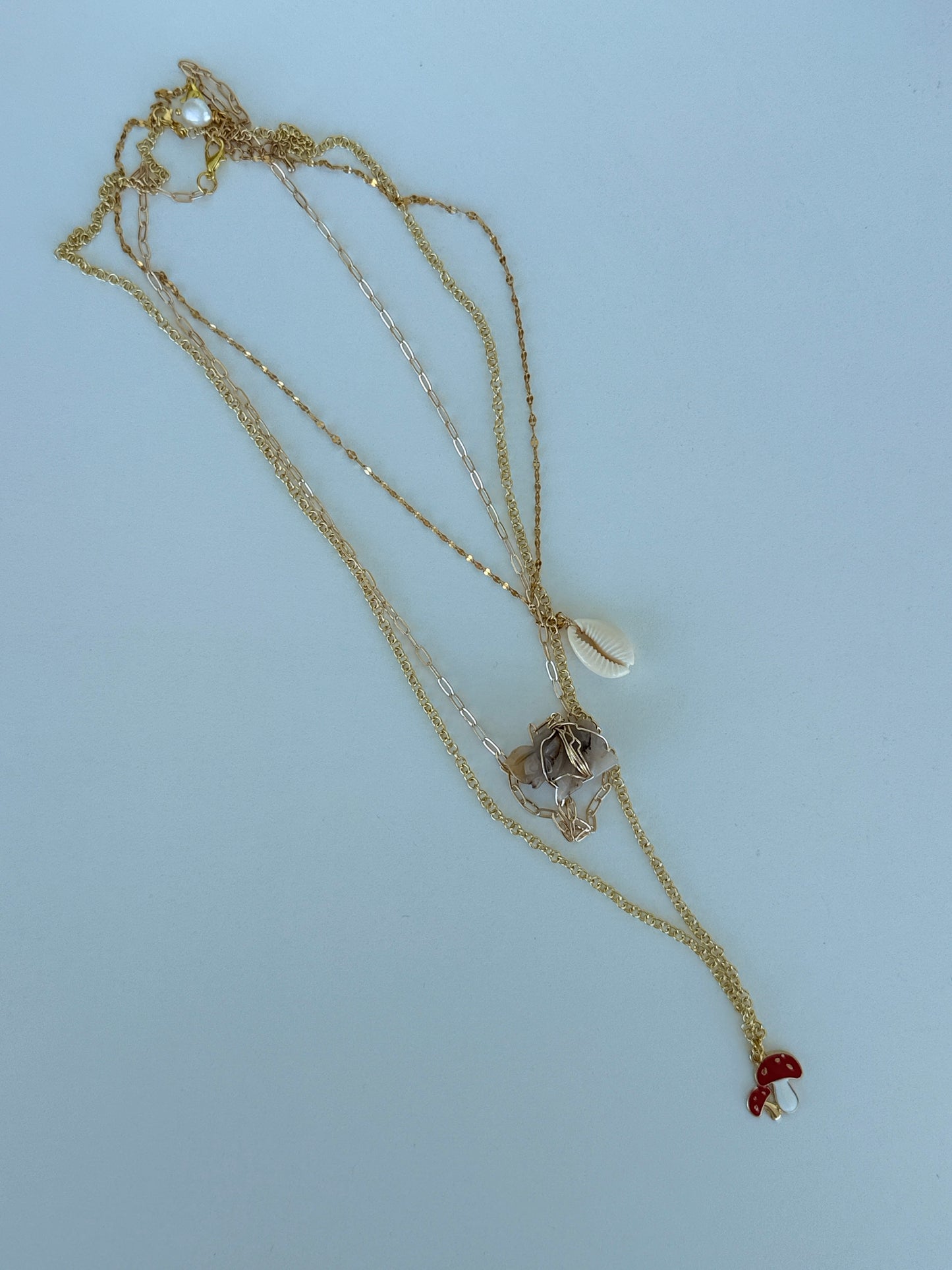 Mercurial Whimsical Gold Charm Necklace | Collar Mercurial de Charms Dorados y Encanto Lúdico - Luna by Cinthia Garcia