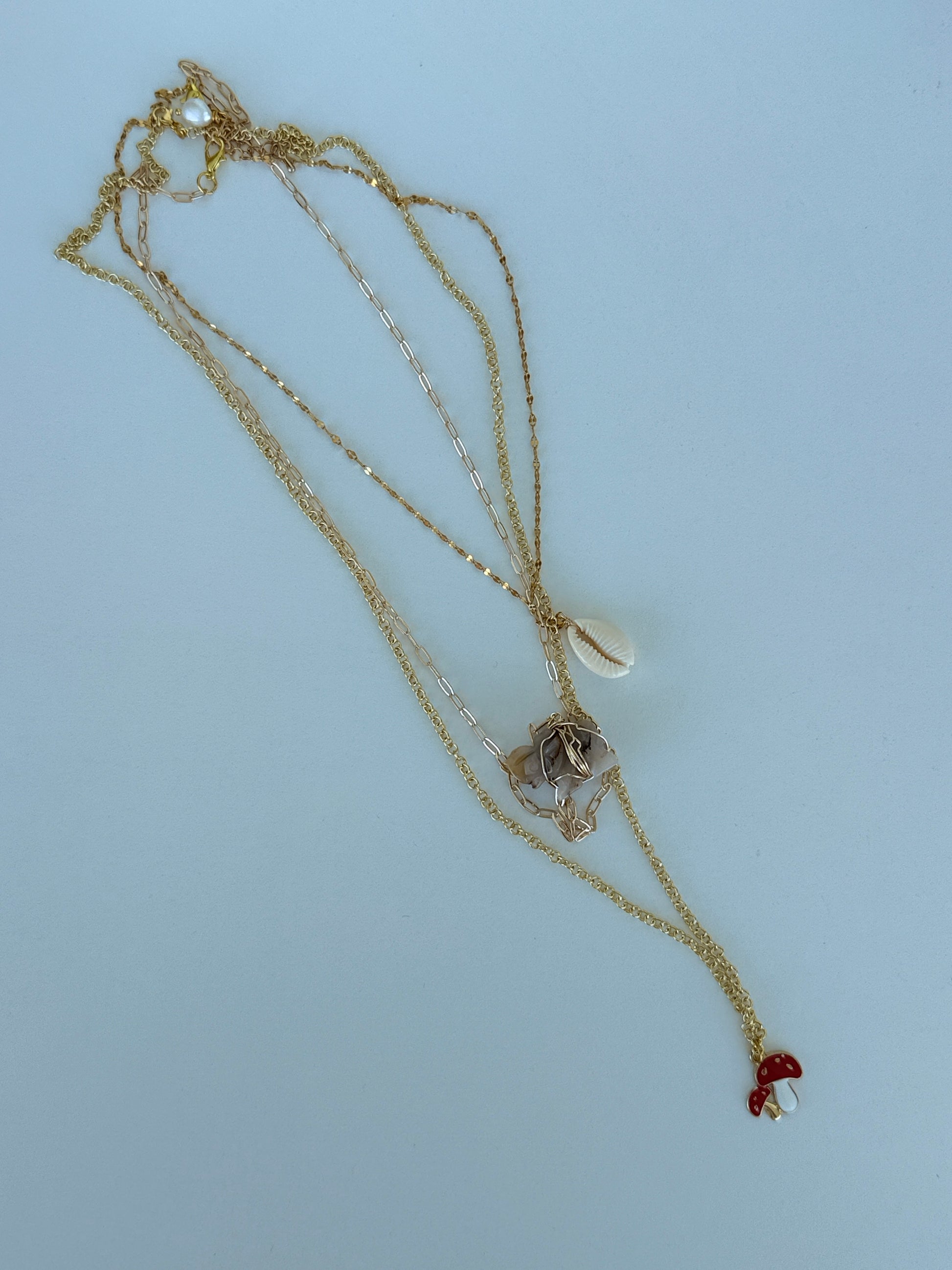 Mercurial Whimsical Gold Charm Necklace | Collar Mercurial de Charms Dorados y Encanto Lúdico - Luna by Cinthia Garcia