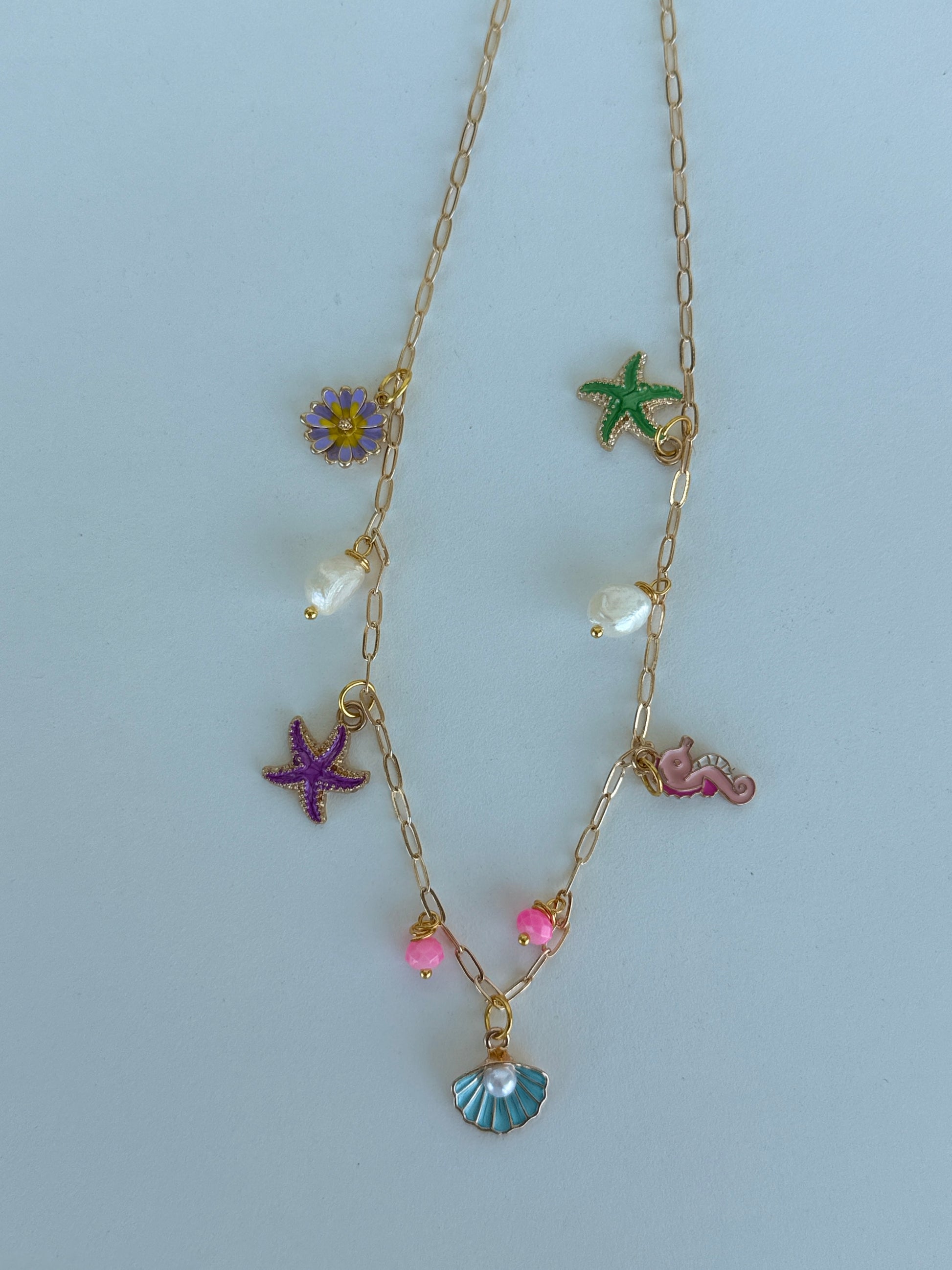 Gold Sea Charm Necklace – Starfish, Seashell & Seahorse Pendant Jewelry - Luna by Cinthia Garcia
