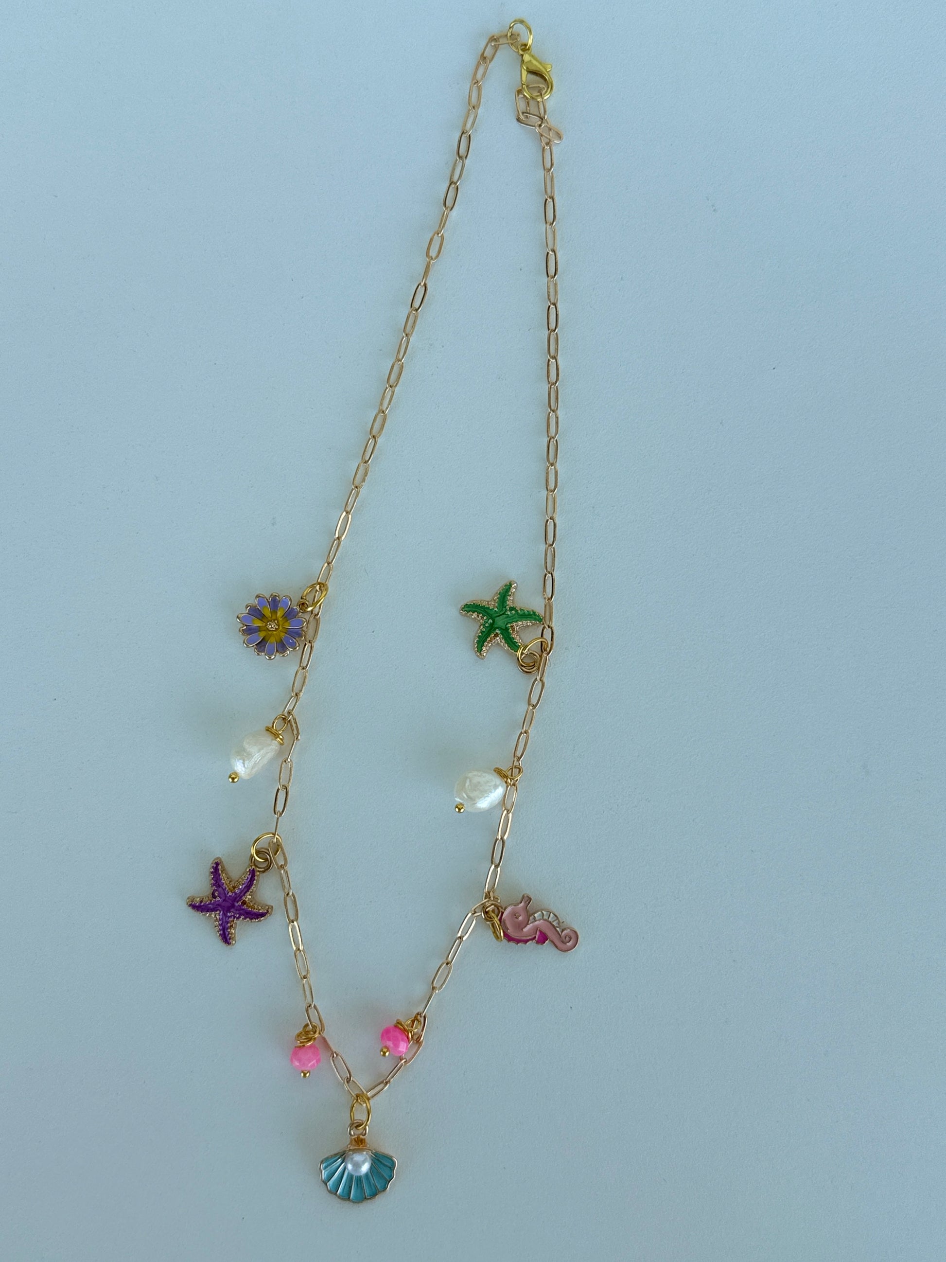 Gold Sea Charm Necklace – Starfish, Seashell & Seahorse Pendant Jewelry - Luna by Cinthia Garcia